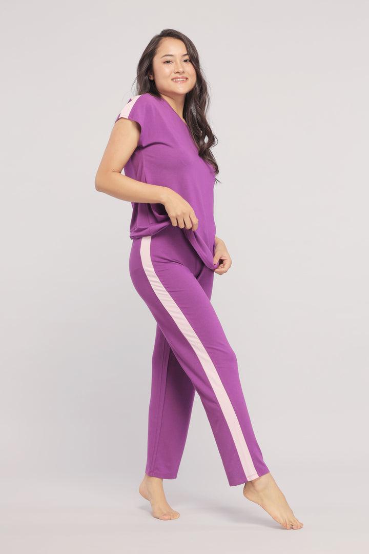 Royal purple lounge set featuring stylish pink stripe details.