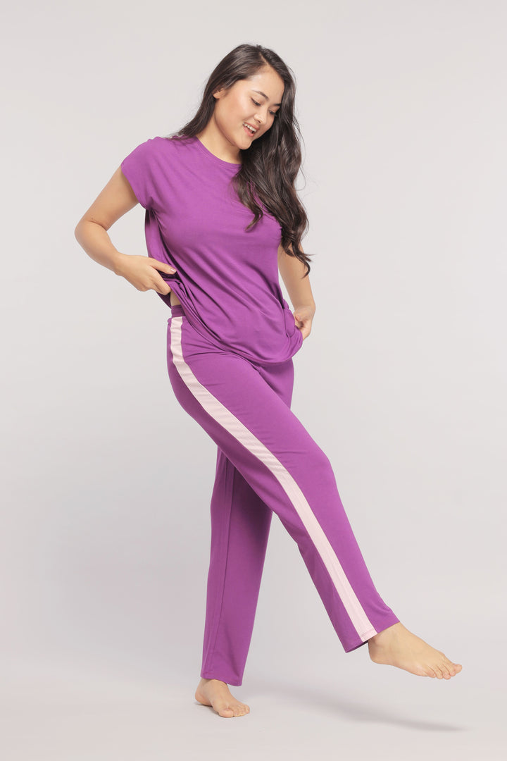 Royal purple lounge set featuring stylish pink stripe detailing.