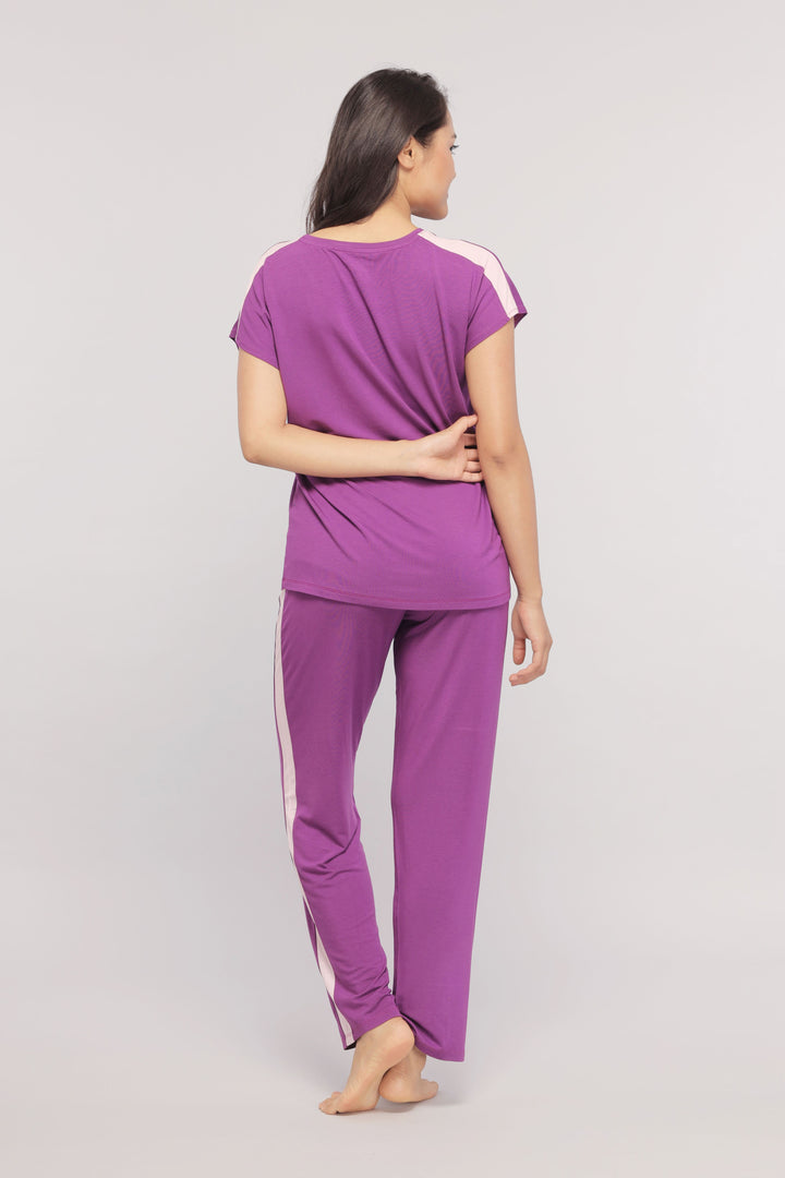 Royal purple lounge set with pink stripes for ultimate comfort.