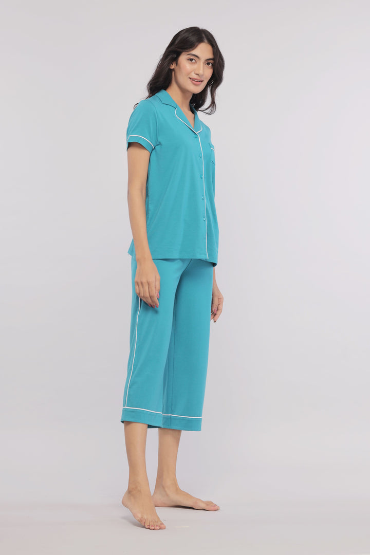 Teal capris with white piping ideal for casual comfort wear.