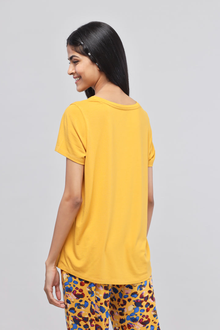 Leopard Print Pajama Set featuring yellow top and colorful pants.