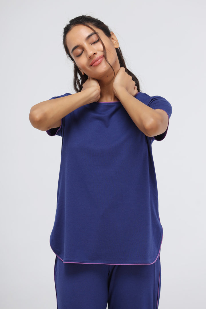 Functional blue Supima® piping lounge top for comfortable relaxation.
