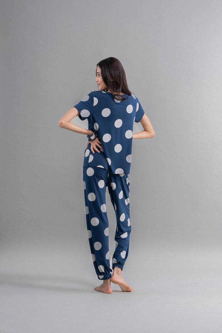 Sleepy Navy Polka Supima Pajama Set showcased on a model.