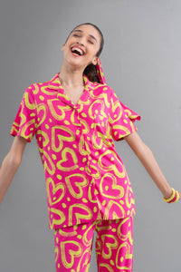 Limited Edition Lovestruck Pink Heart Half Sleeve Shirt model wearing vibrant outfit.
