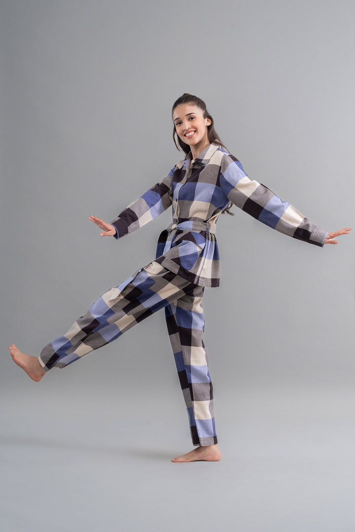 Grey cotton plaid pajama set model posing playfully.