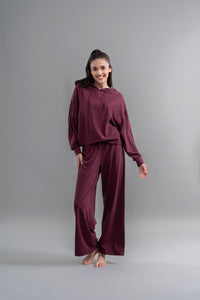 Limited Edition Luxflo® Travel Ruby Hoodie Set model posing elegantly.