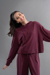 Limited Edition Luxflo® Travel Ruby Hoodie showcased on a smiling model.