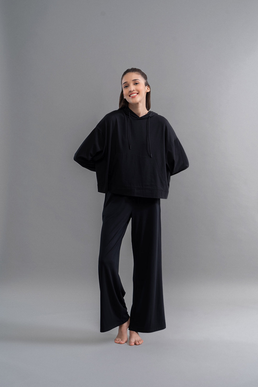 Limited Edition Luxflo® Travel Black Hoodie Set on a model.