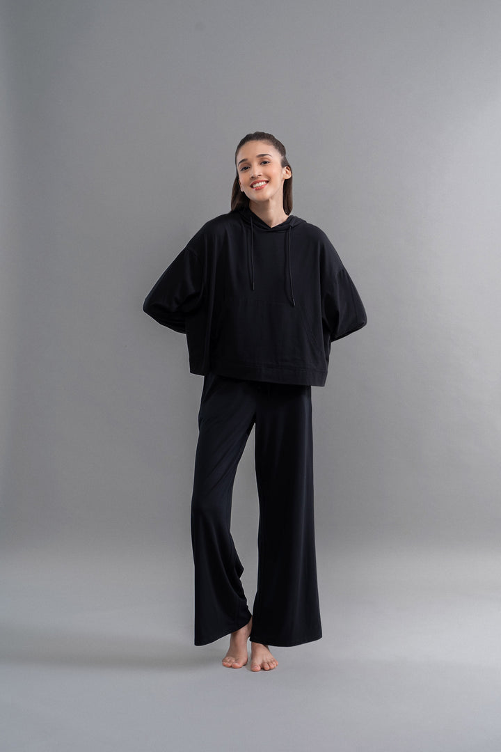 Limited Edition Luxflo® Travel Black Hoodie Set on a model.