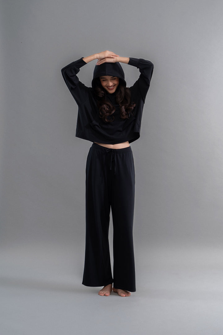 Limited Edition Luxflo® Travel Black Hoodie Set on a model.