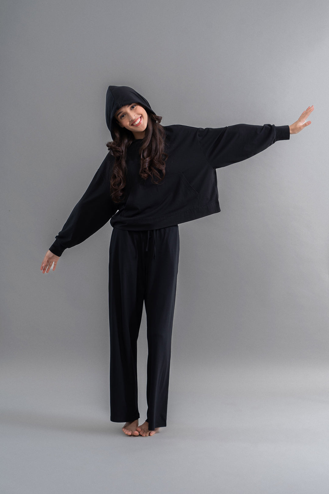 Limited Edition Luxflo® Travel Black Hoodie Set on model.