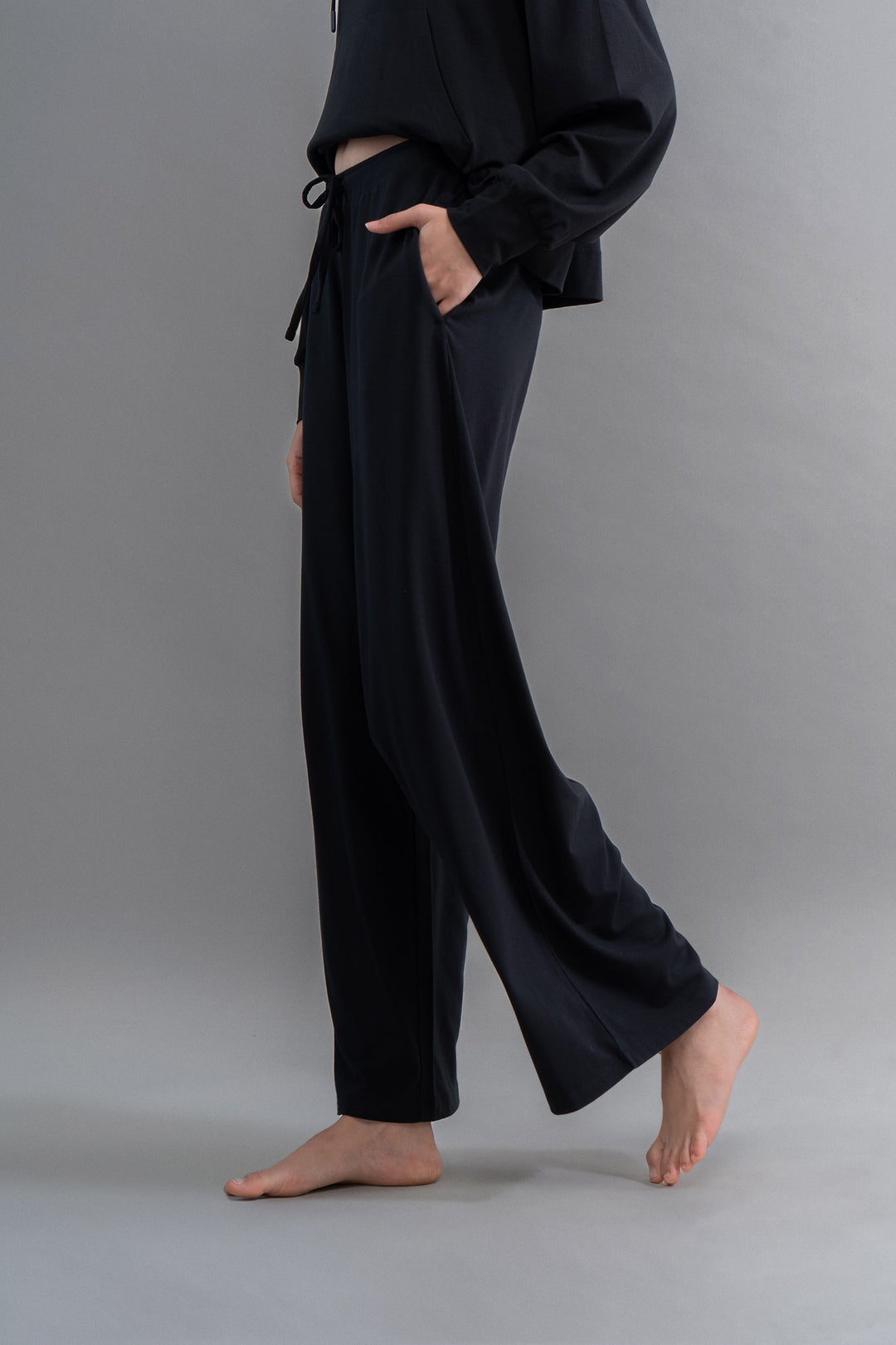 Limited Edition Luxflo® black flared pajamas for stylish travel comfort.