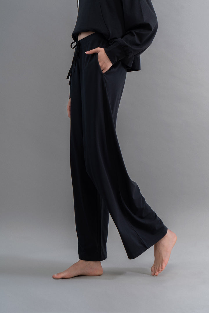 Limited Edition Luxflo® black flared pajamas for stylish travel comfort.