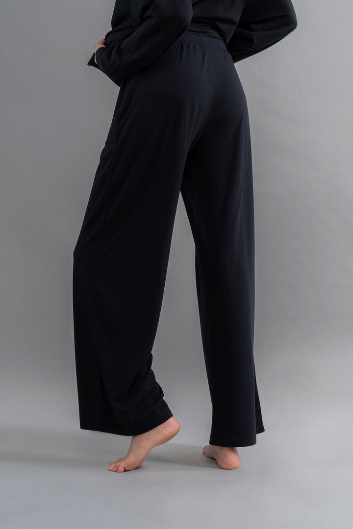 Limited Edition Luxflo® black flared pajamas for travel comfort.