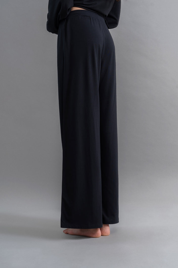 Limited Edition Luxflo® Black Flared Pajamas elegantly styled for travel comfort.