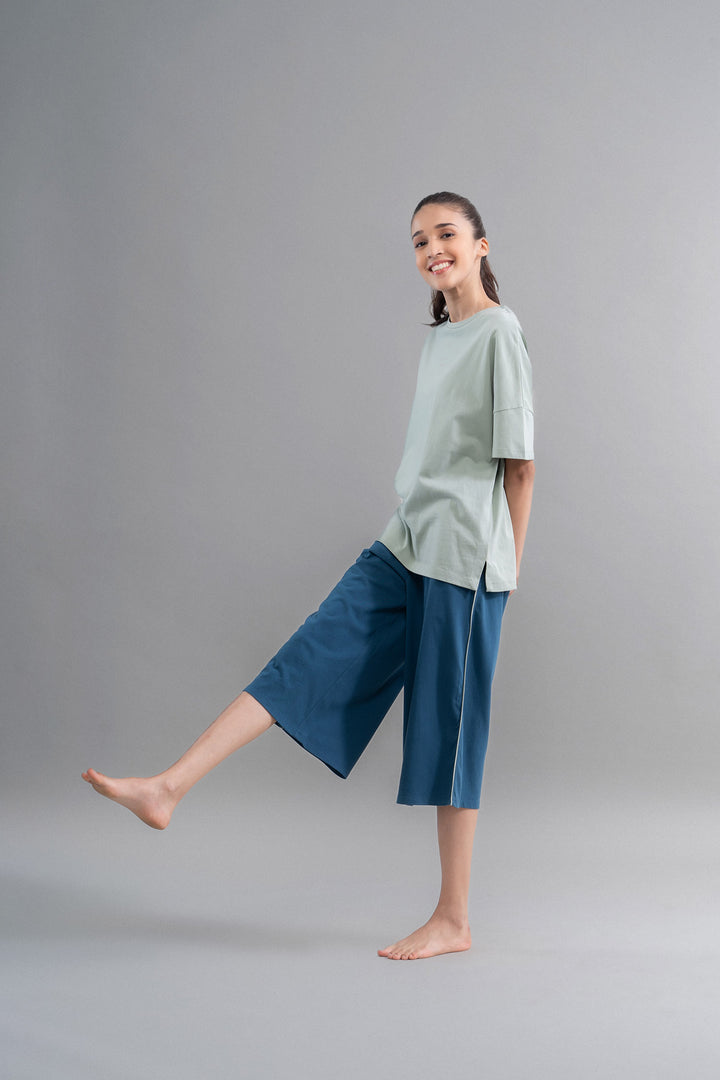 Sage teal cotton culottes styled with a casual outfit.