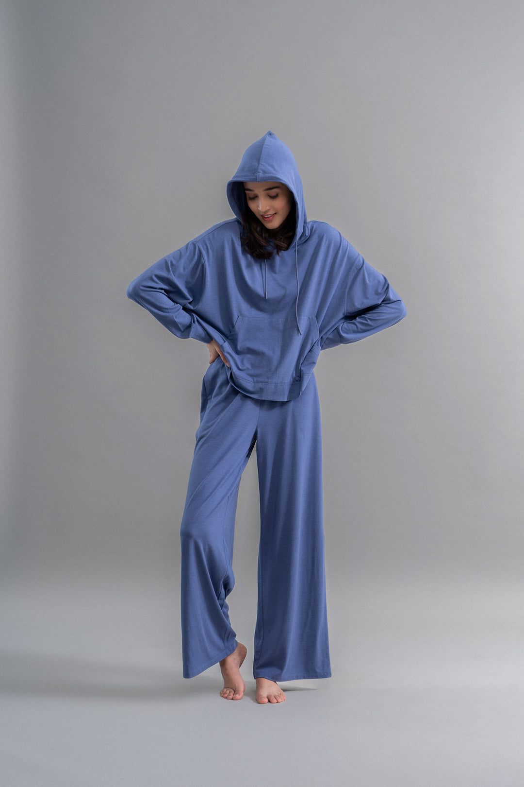Limited Edition Luxflo® Travel Hoodie Set in blue on model.