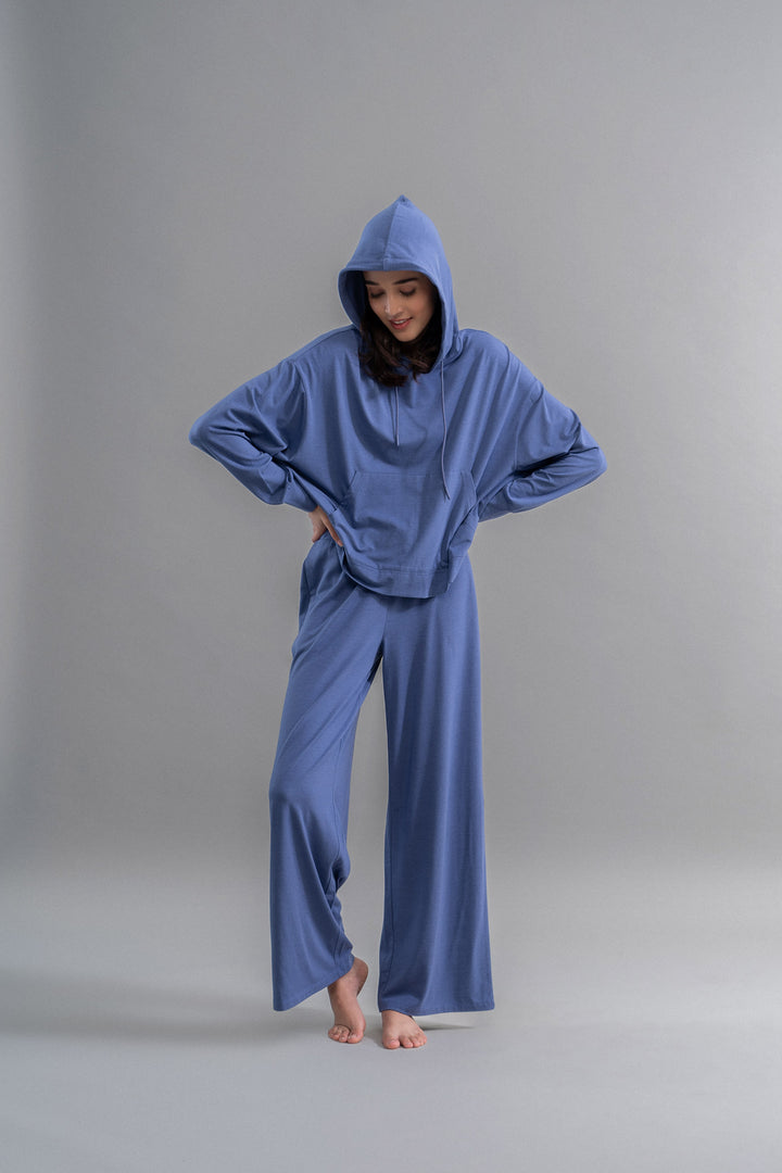Limited Edition Luxflo® Travel Hoodie Set in blue on model.