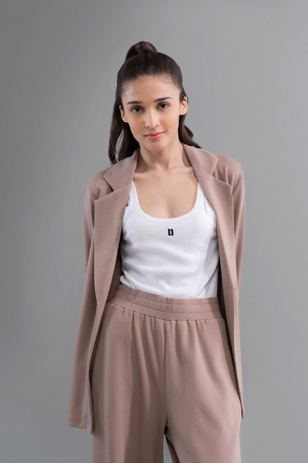 Model wearing Snugknit® Mocha Blazer with matching pants.