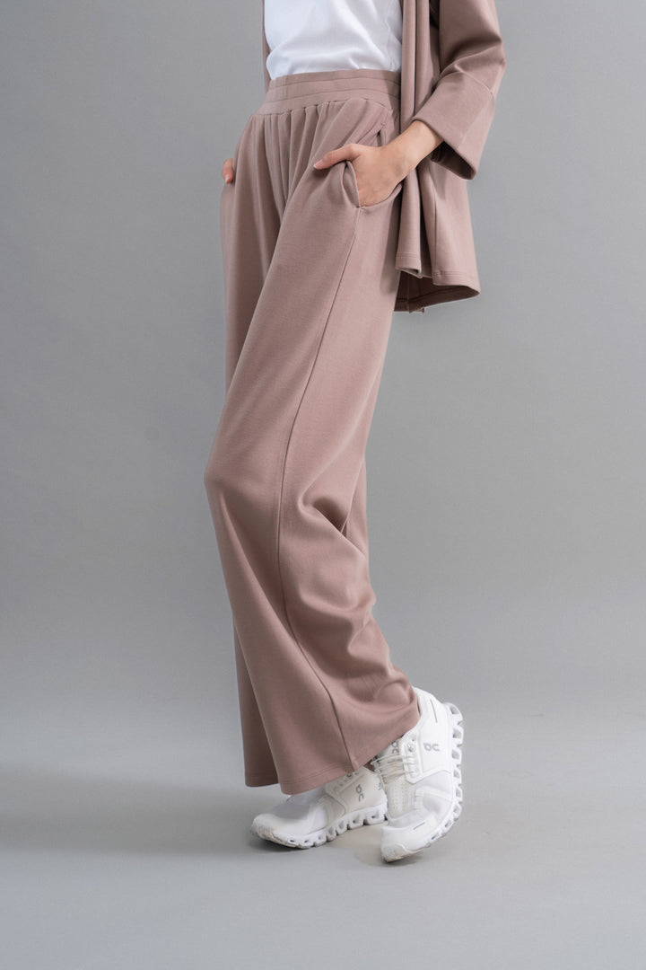 Snugknit® Mocha Flared Pant paired with stylish white sneakers.