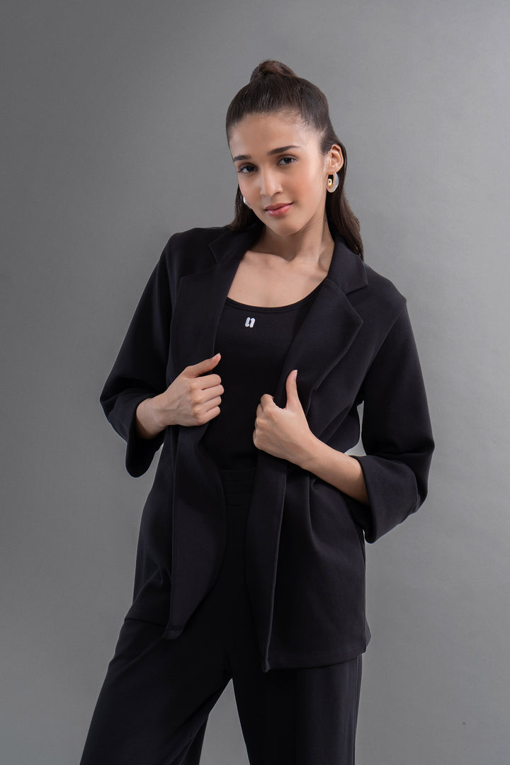 Model wearing Snugknit® Black Blazer, styled for elegance and comfort.