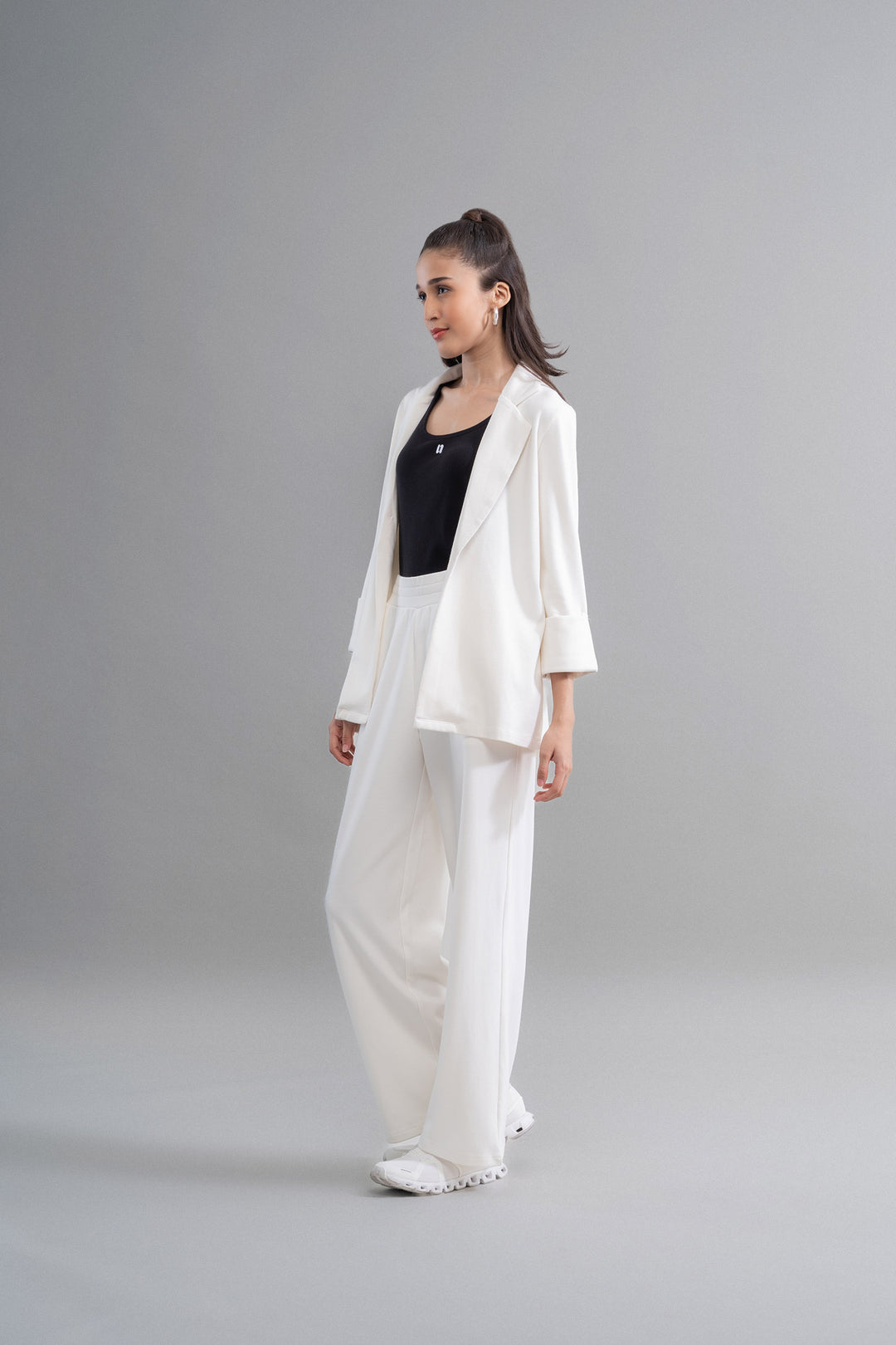 Snugknit® ivory blazer set with wide-leg pants and sleek top.