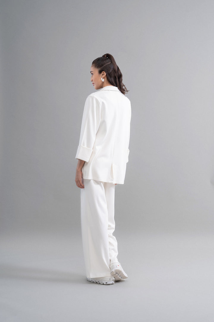 Woman wearing Snugknit® Ivory Blazer Set, view from behind.