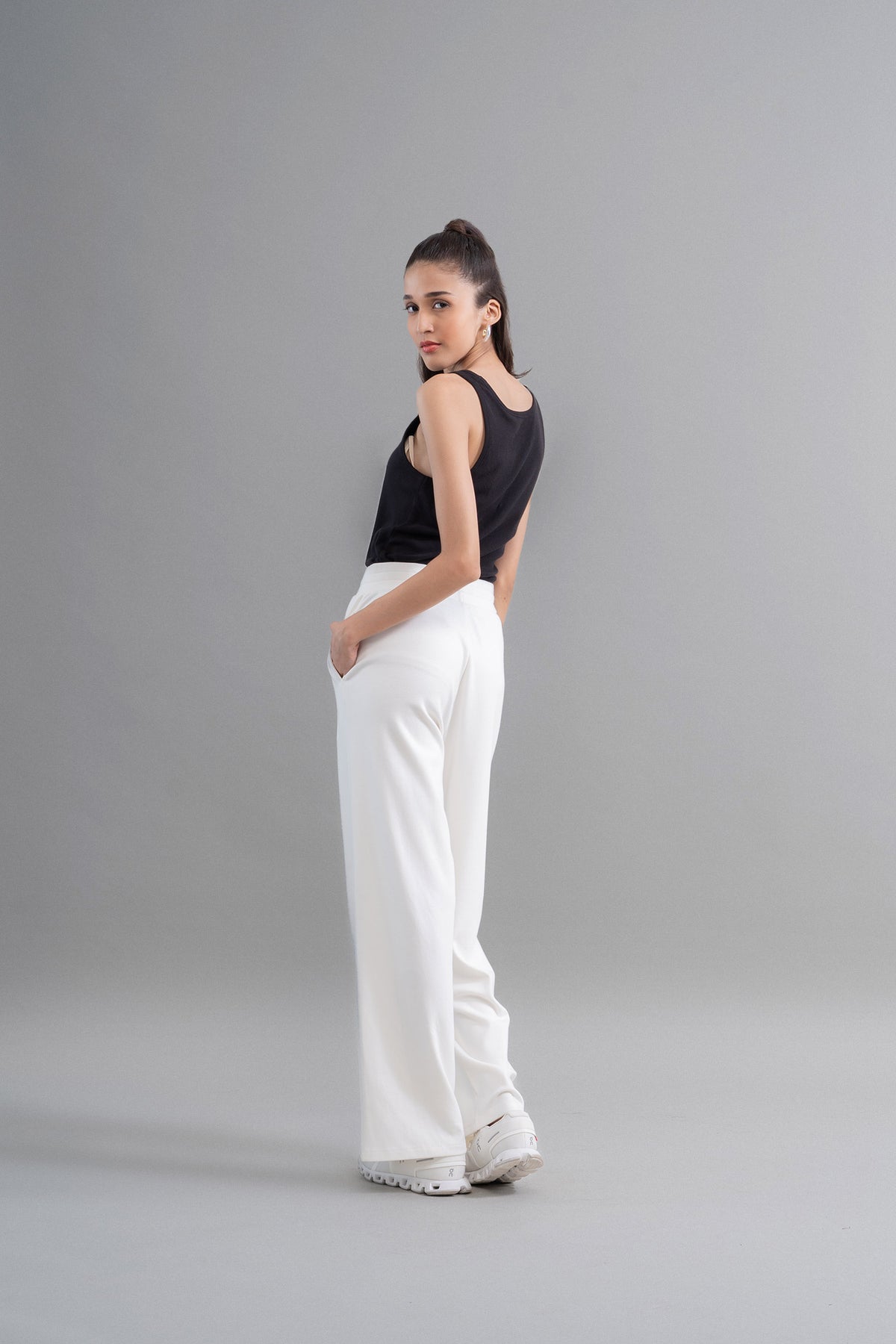 Model showcasing Snugknit® Ivory Flared Pant from behind.