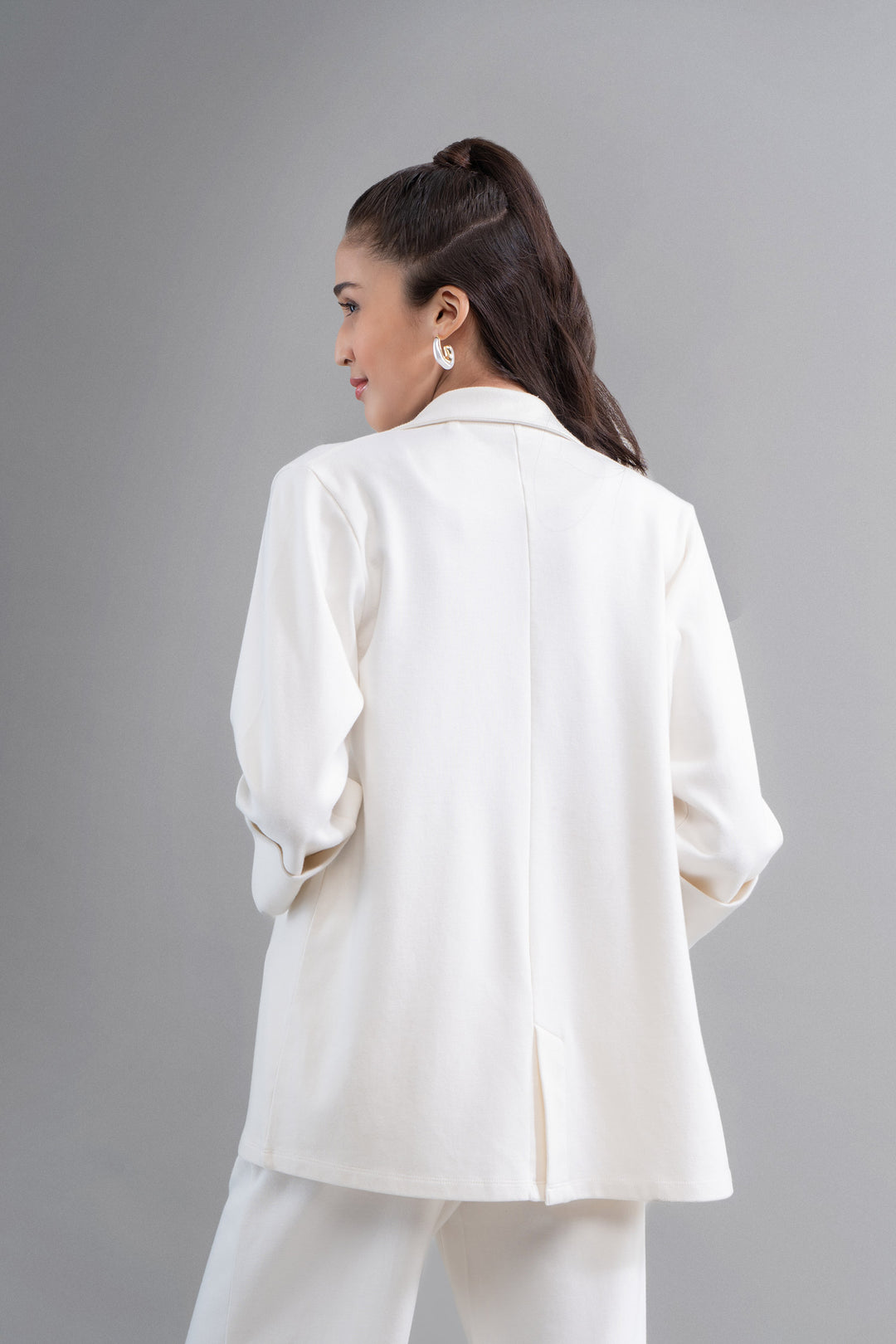 Model showcasing Snugknit® ivory blazer from the back.