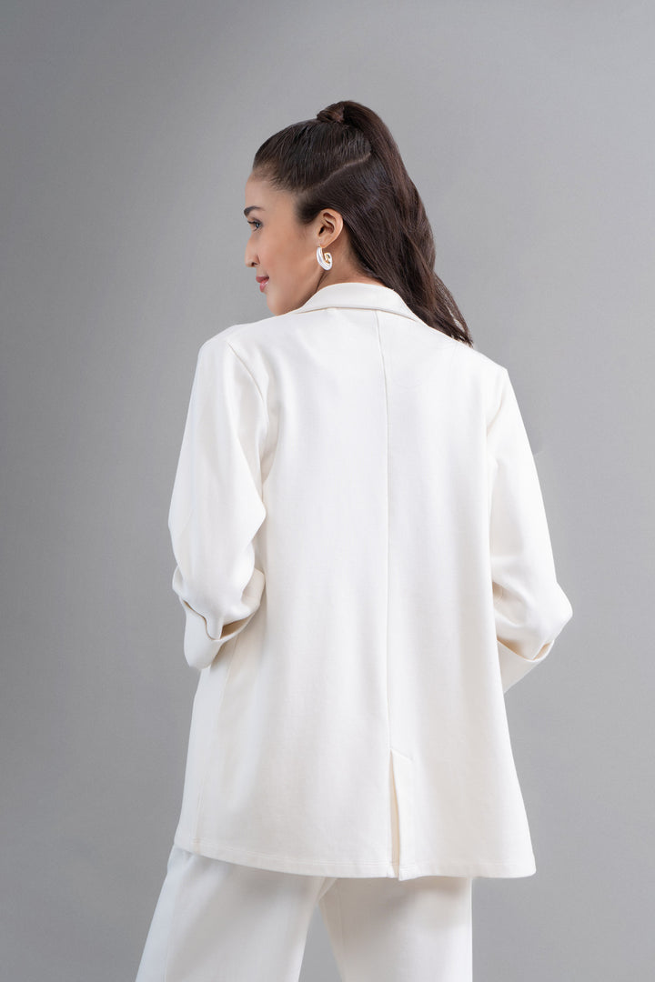 Model showcasing Snugknit® ivory blazer from the back.