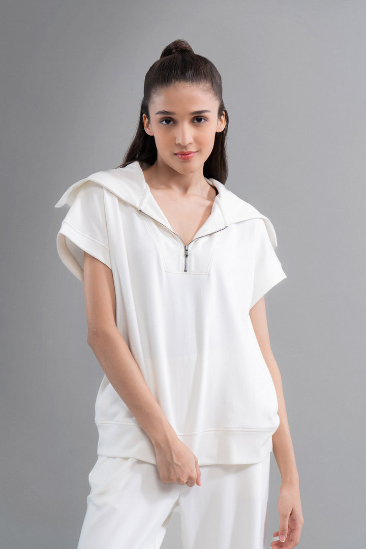 Snugknit® ivory polo top with zip and hooded design.