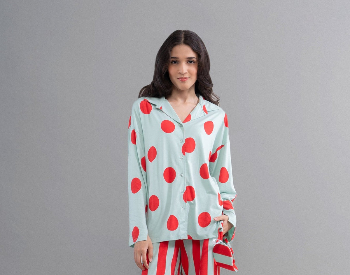 Sage button-down shirt featuring vibrant red polka dots for stylish comfort.