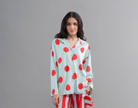 Sage button-down shirt featuring vibrant red polka dots for stylish comfort.