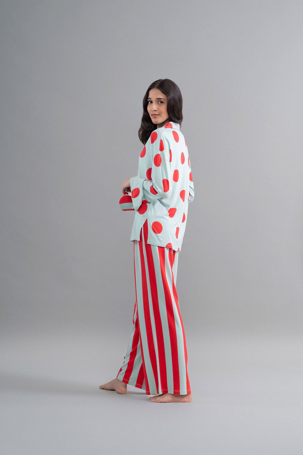 Aqua red stripe Supima flared pajamas on model with polka dot top.