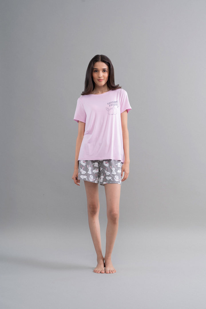 Model wearing Cuddly Bunnies Grey Modal Shorts and pink top.