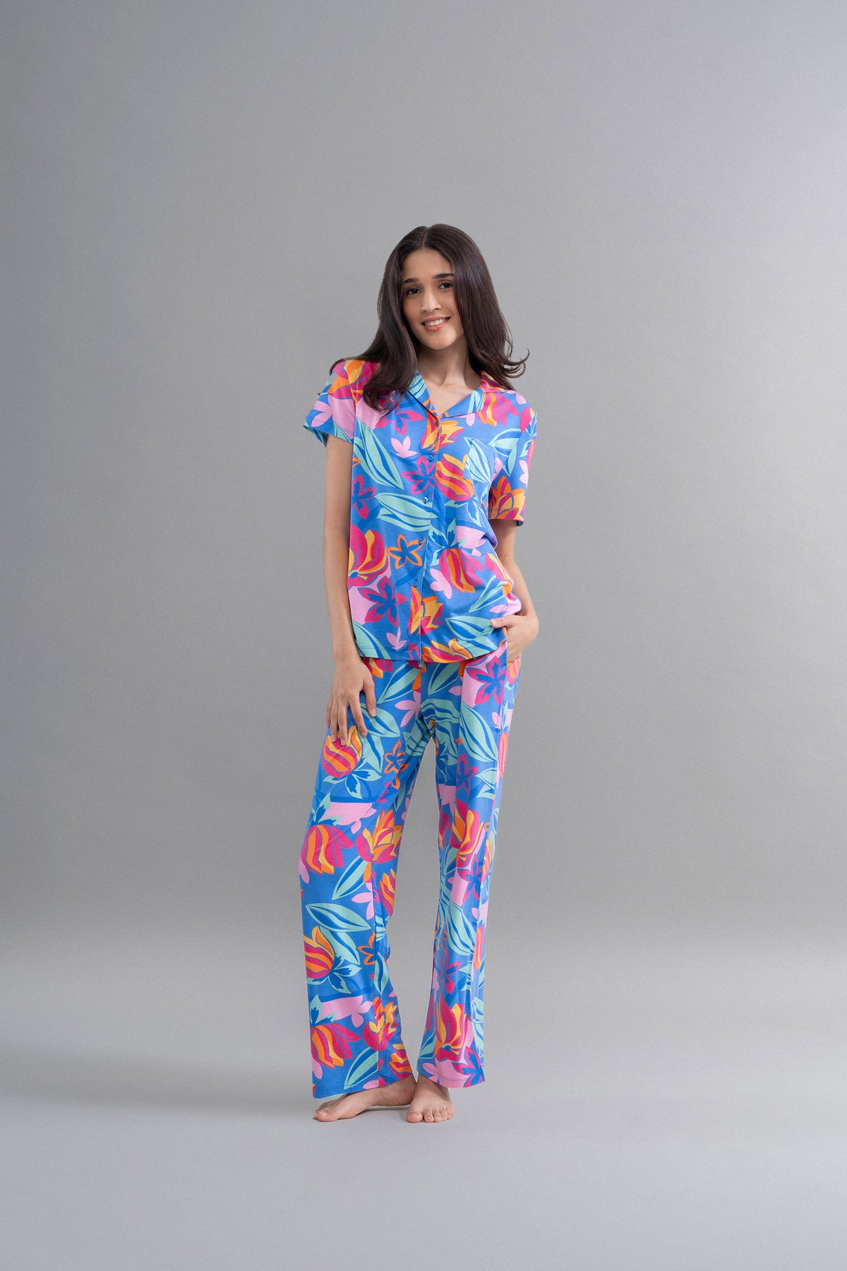 Hawai Button Down Printed Half Sleeve Pajama Set model posing in vibrant floral design.