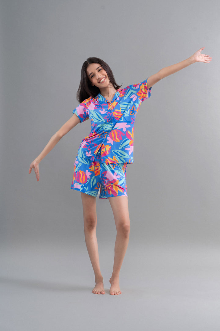 Hawaii Flower Modal Shorts on a model showcasing vibrant tropical design.