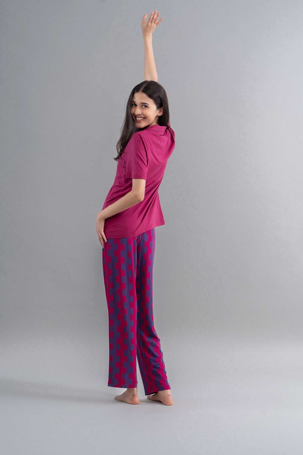 Model wearing Ruby Supima Straight Pajamas in vibrant colors.