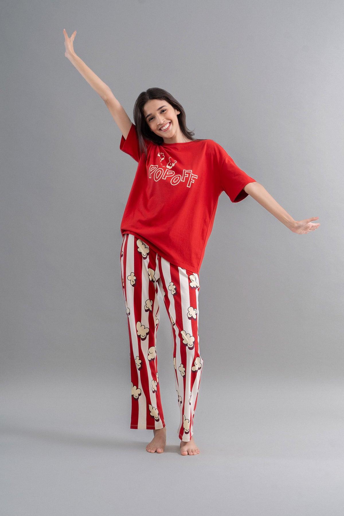 Stylish red pajama set with popcorn print for movie nights.