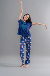 Wanderlust Blue Modal Pajama Set featuring cheerful model in stylish loungewear.