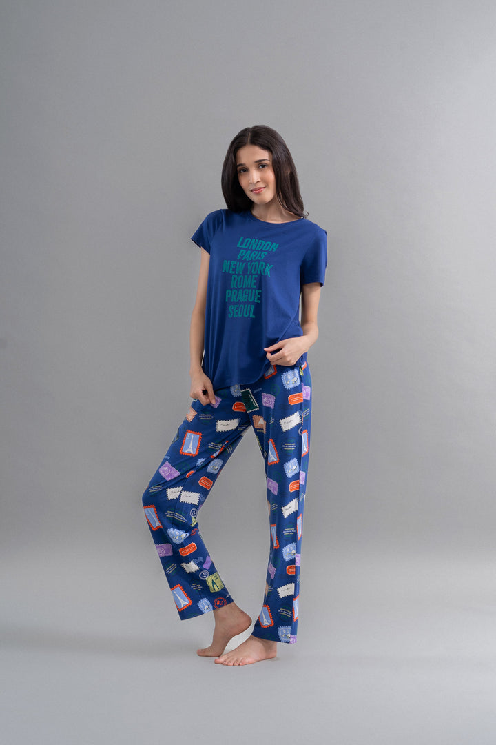 Wanderlust Blue Modal Pajama Set on model, featuring travel-themed designs.
