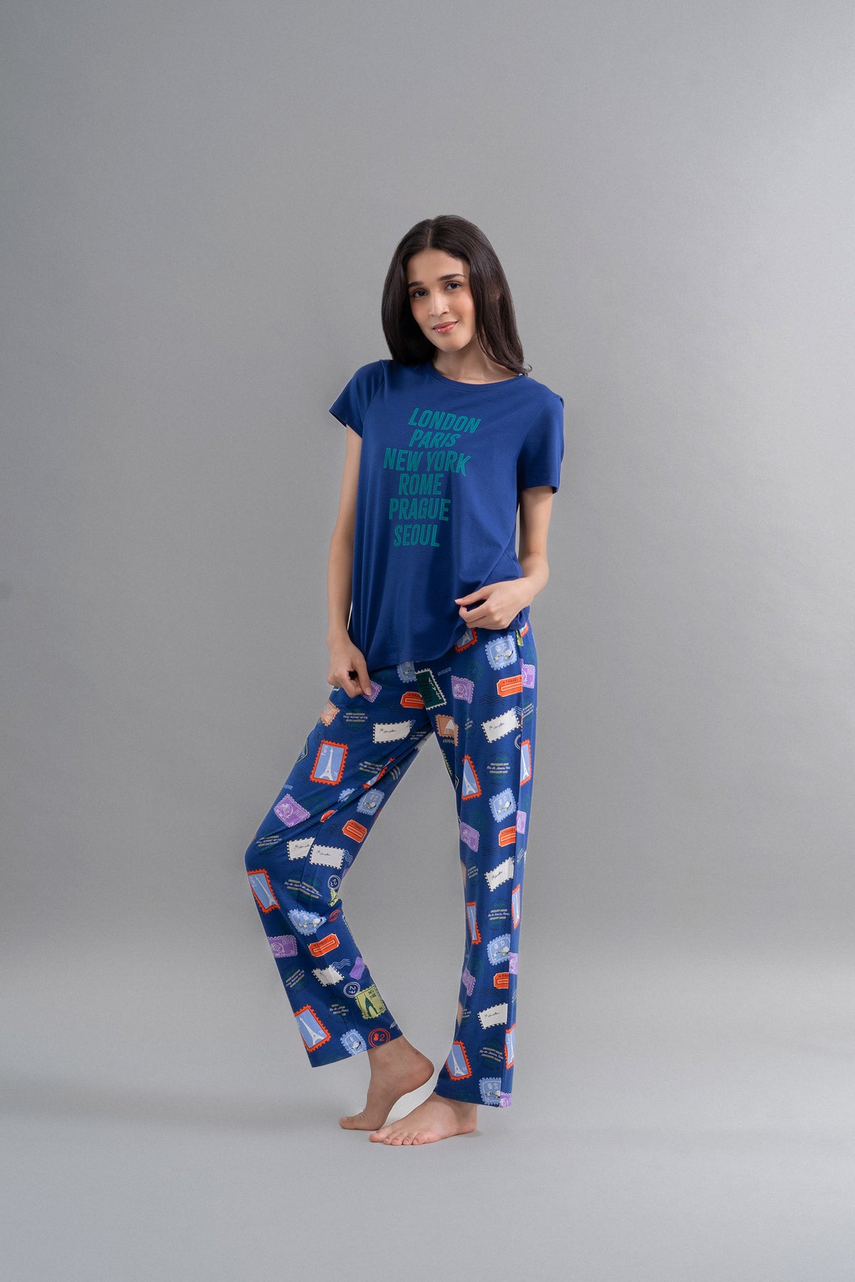 Wanderlust solid modal round neck top with travel-themed pajama pants.