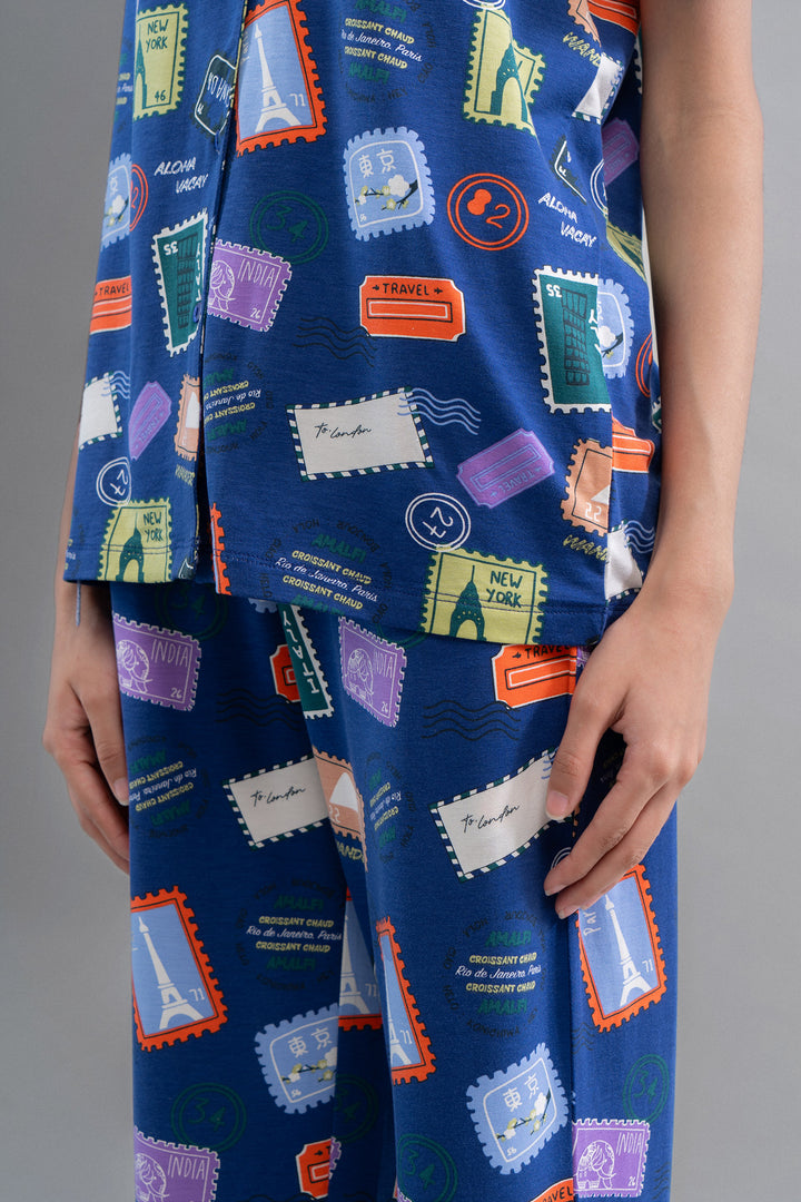 Wanderlust blue modal pajama set featuring travel-themed stamp prints.
