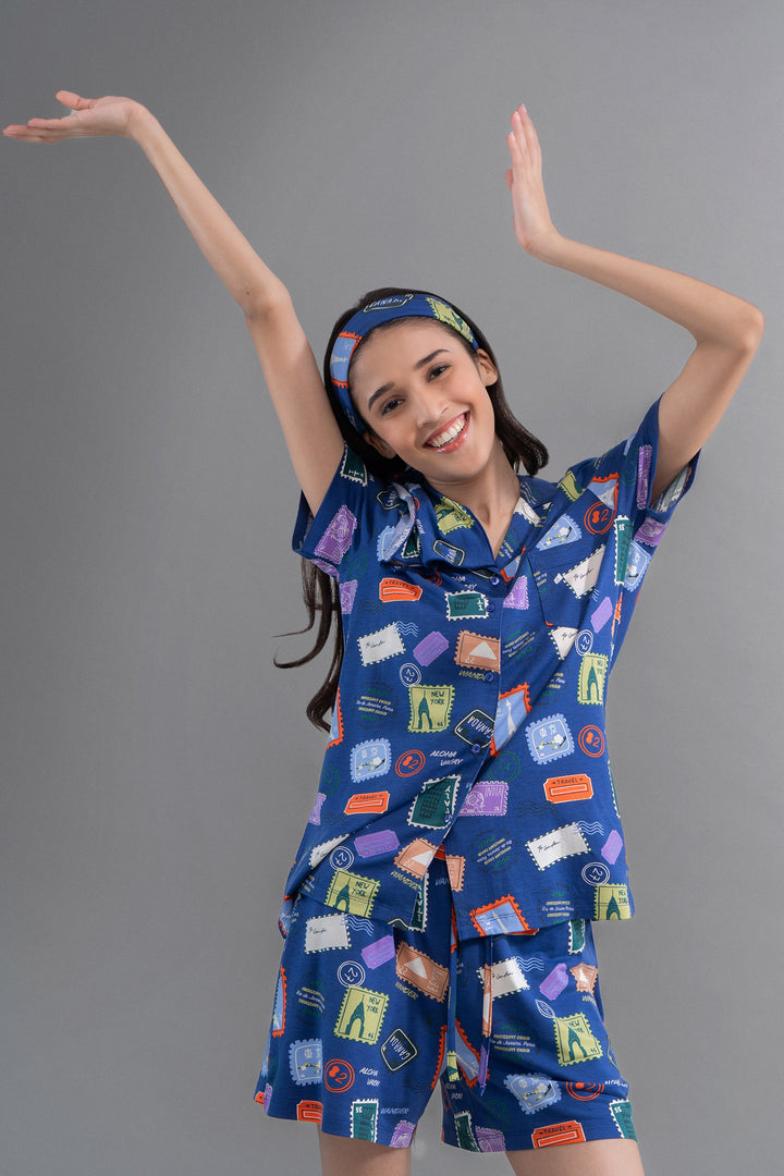 Wanderlust Blue Modal Button Down Shorts Set with playful travel-themed patterns.
