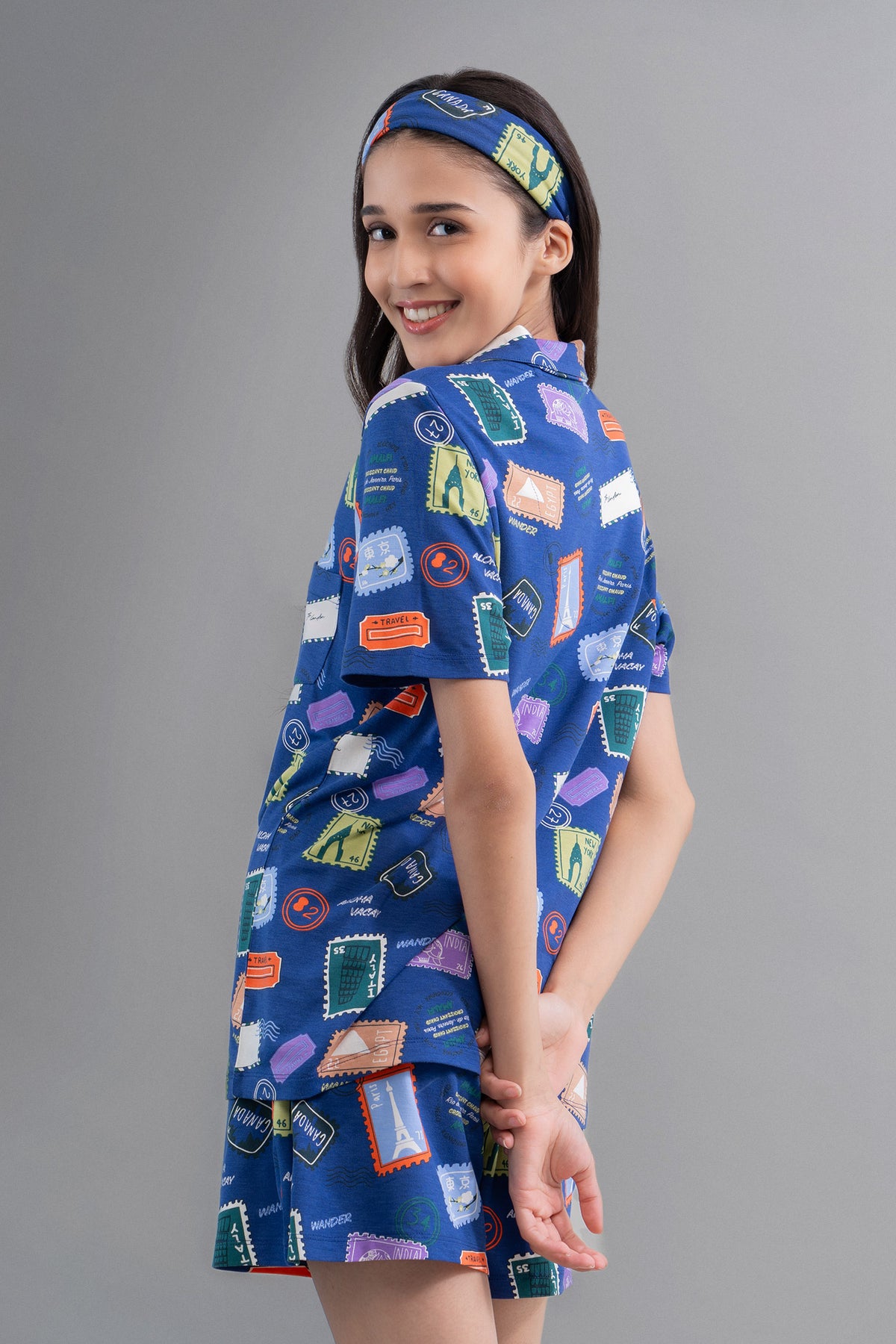 Wanderlust Blue Modal Shorts with playful stamp pattern, perfect for travel.