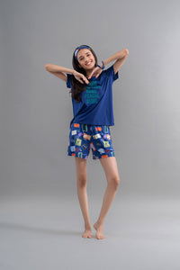Wanderlust Blue Modal Shorts Set model showing playful pose and travel-themed design.