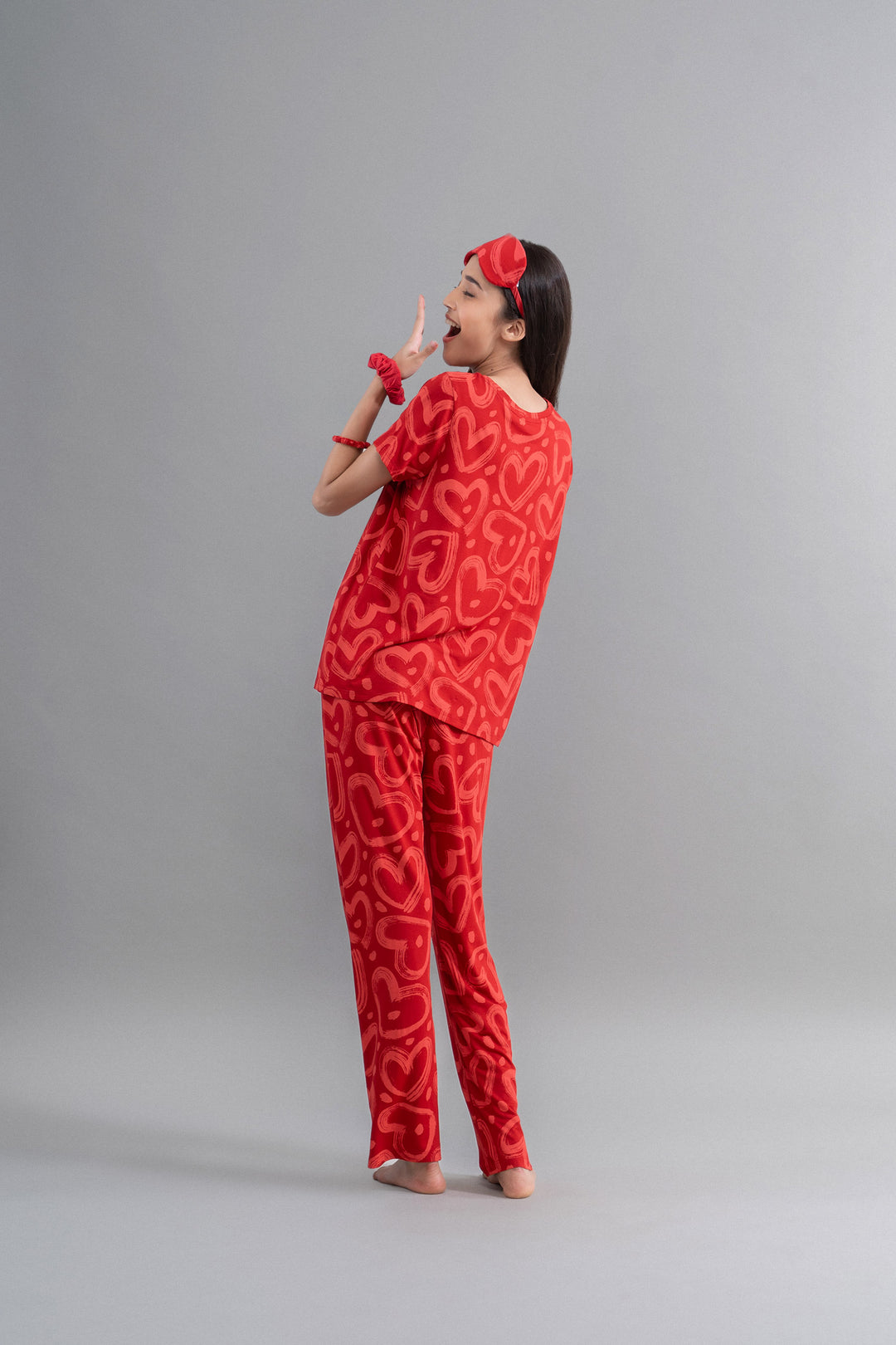 Lovestruck Hearts Red Pajama Set featuring playful heart patterns.