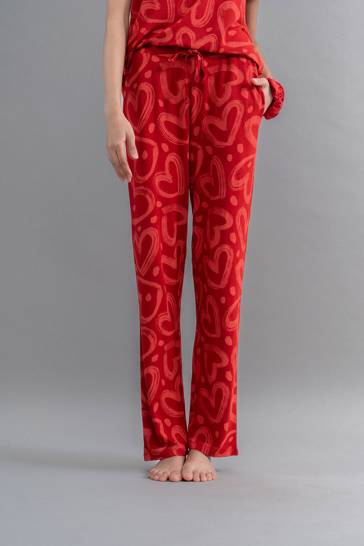 Lovestruck Hearts red pajama set with playful heart patterns.
