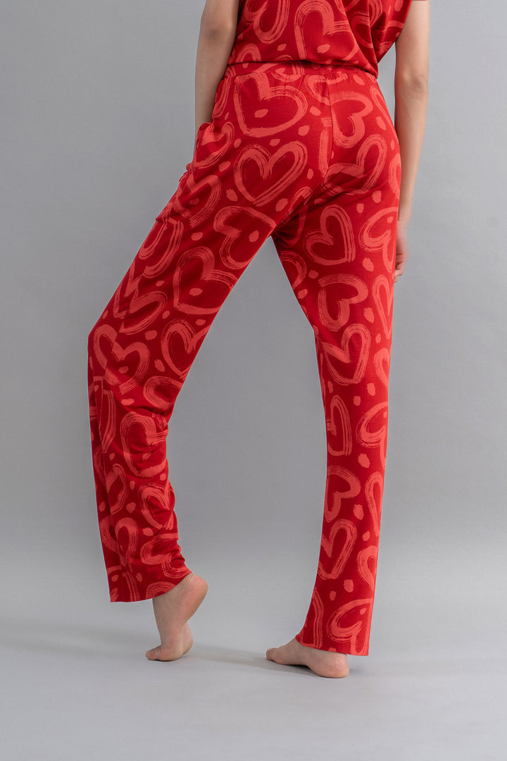 Lovestruck Hearts Red Pajamas with playful heart patterns, stylish and comfortable.