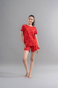 Lovestruck Hearts Red Shorts Set worn by smiling model.